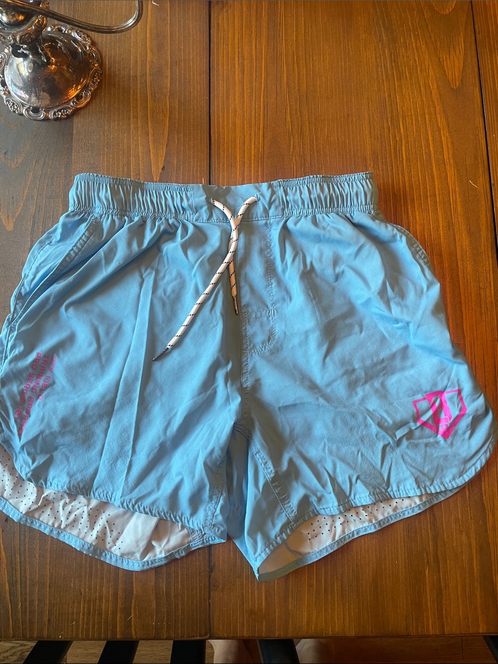Youth baseball 101 shorts Light BlueAthletic Shorts with Pink Logo small
